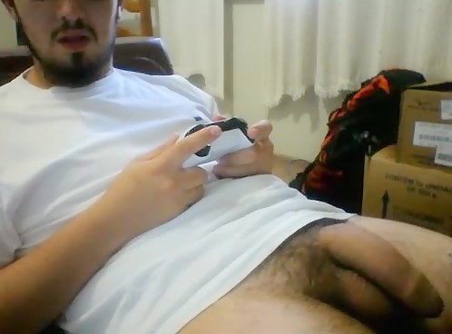 Brazilian guy playing video games and showing off his big dick on webcam